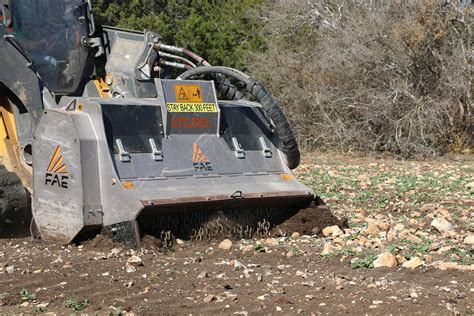 stone crusher for skid steer|skid steer rock milling attachment.